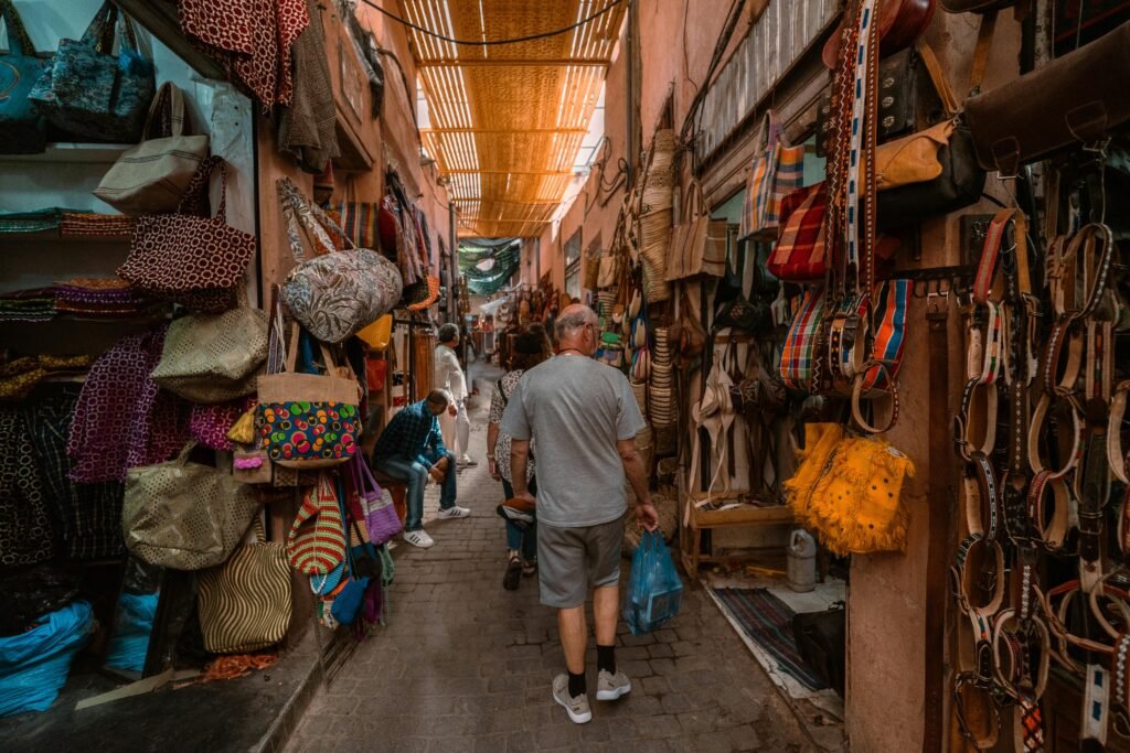 Explore the bustling souk in Marrakech with colorful textiles and local crafts on display.