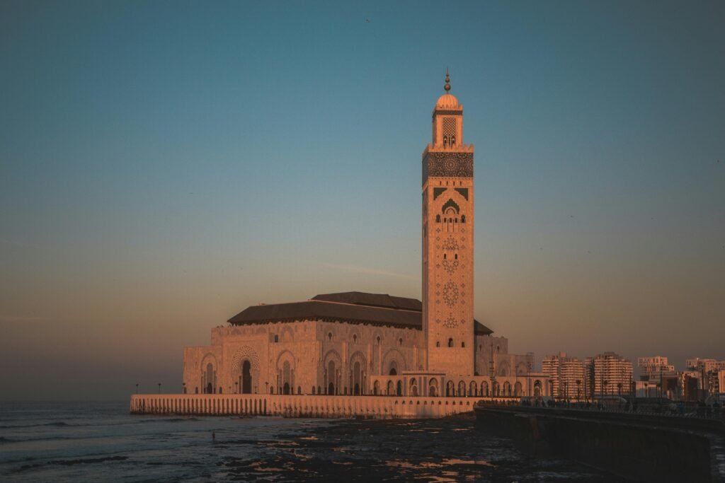 Stunning view of Hassan II Mosque against the sunset sky in Casablanca, Morocco.