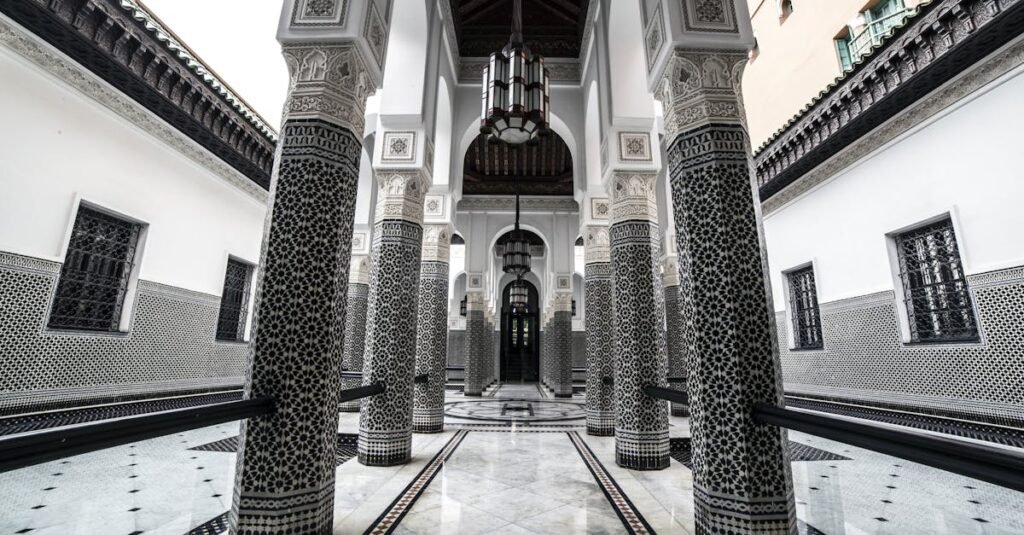 Elegant Moroccan architecture with intricate columns and arches in Marrakech.