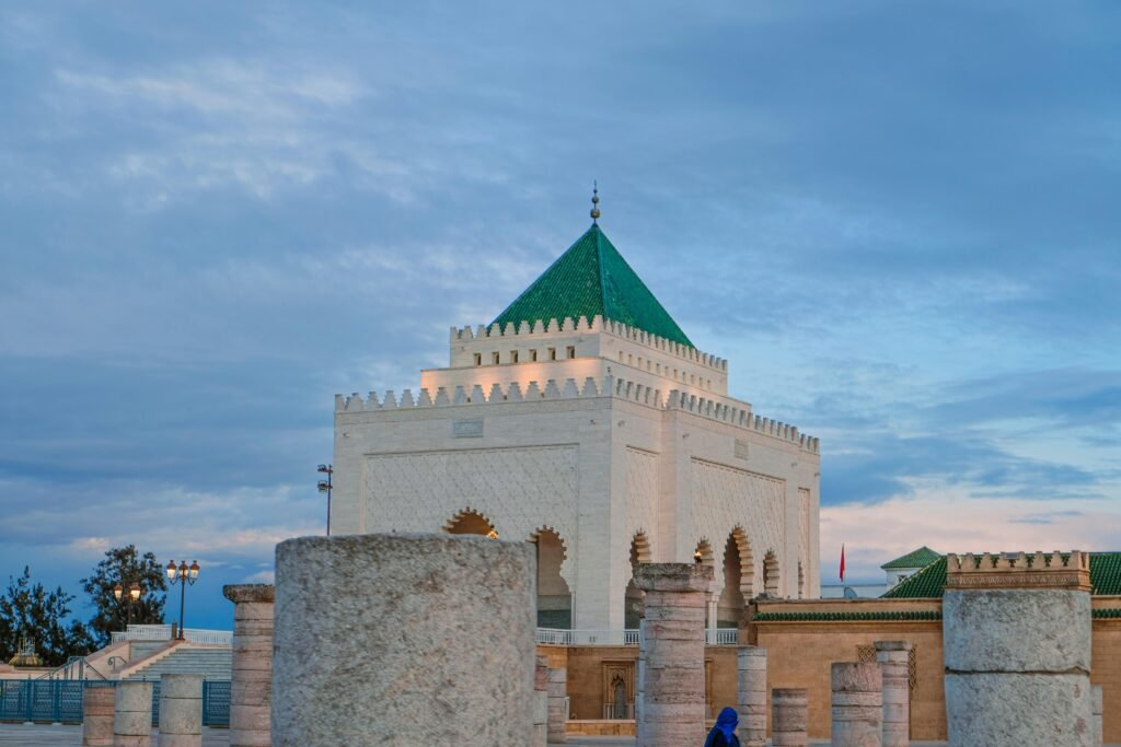 Historic Hassan Tower with Mausoleum in Rabat, Morocco at sunset, capturing Moroccan architecture.